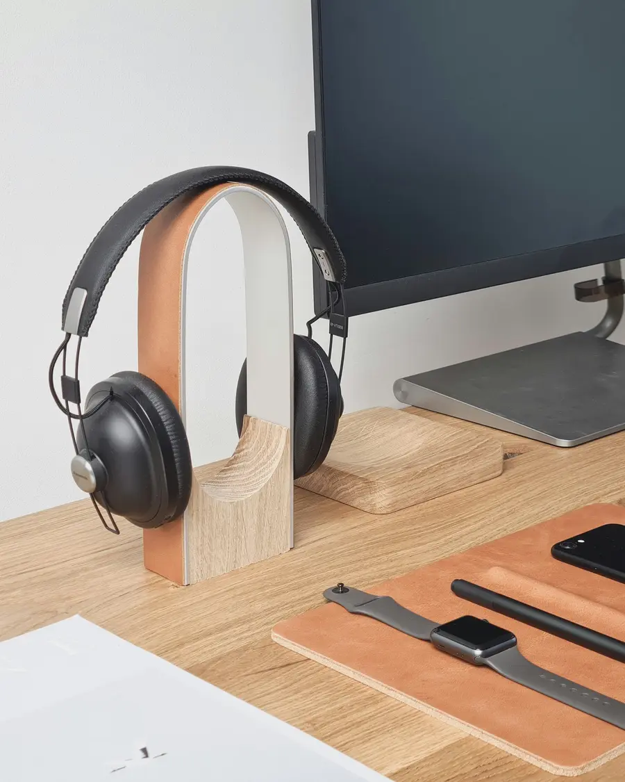 Headphones resting on a wooden desk